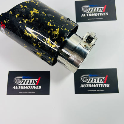 Akrapovic yellow forged carbon tip installed on vehicle exhaust