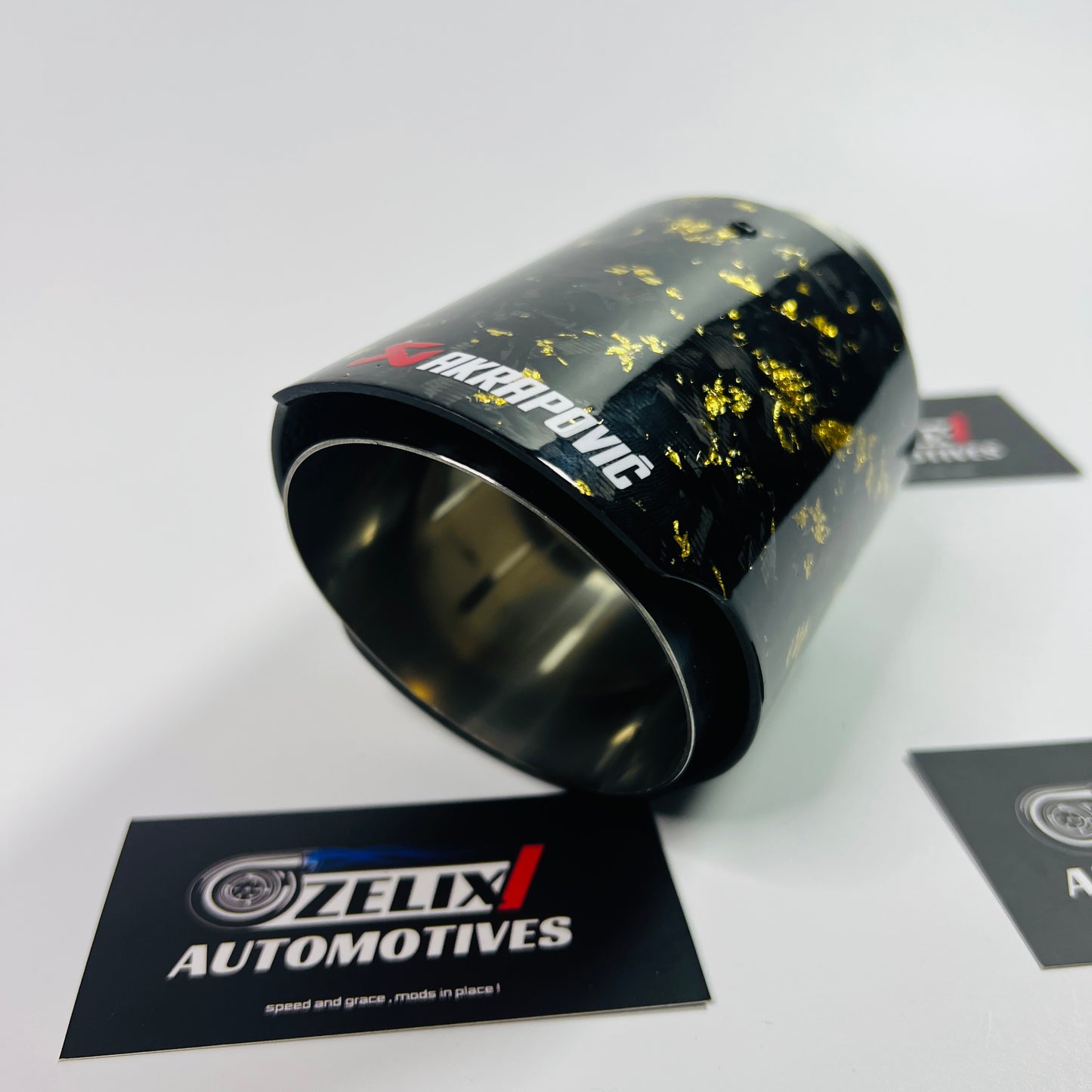 Side profile of Akrapovic yellow forged carbon exhaust tip