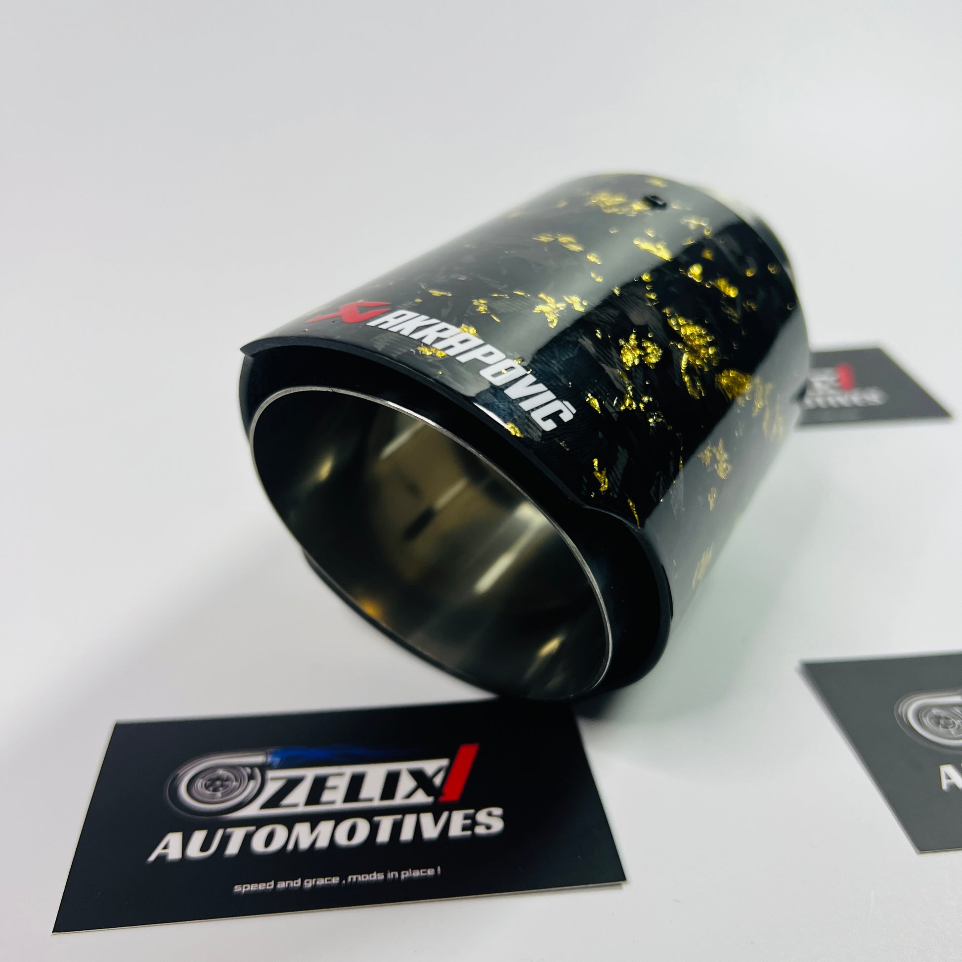 Side profile of Akrapovic yellow forged carbon exhaust tip