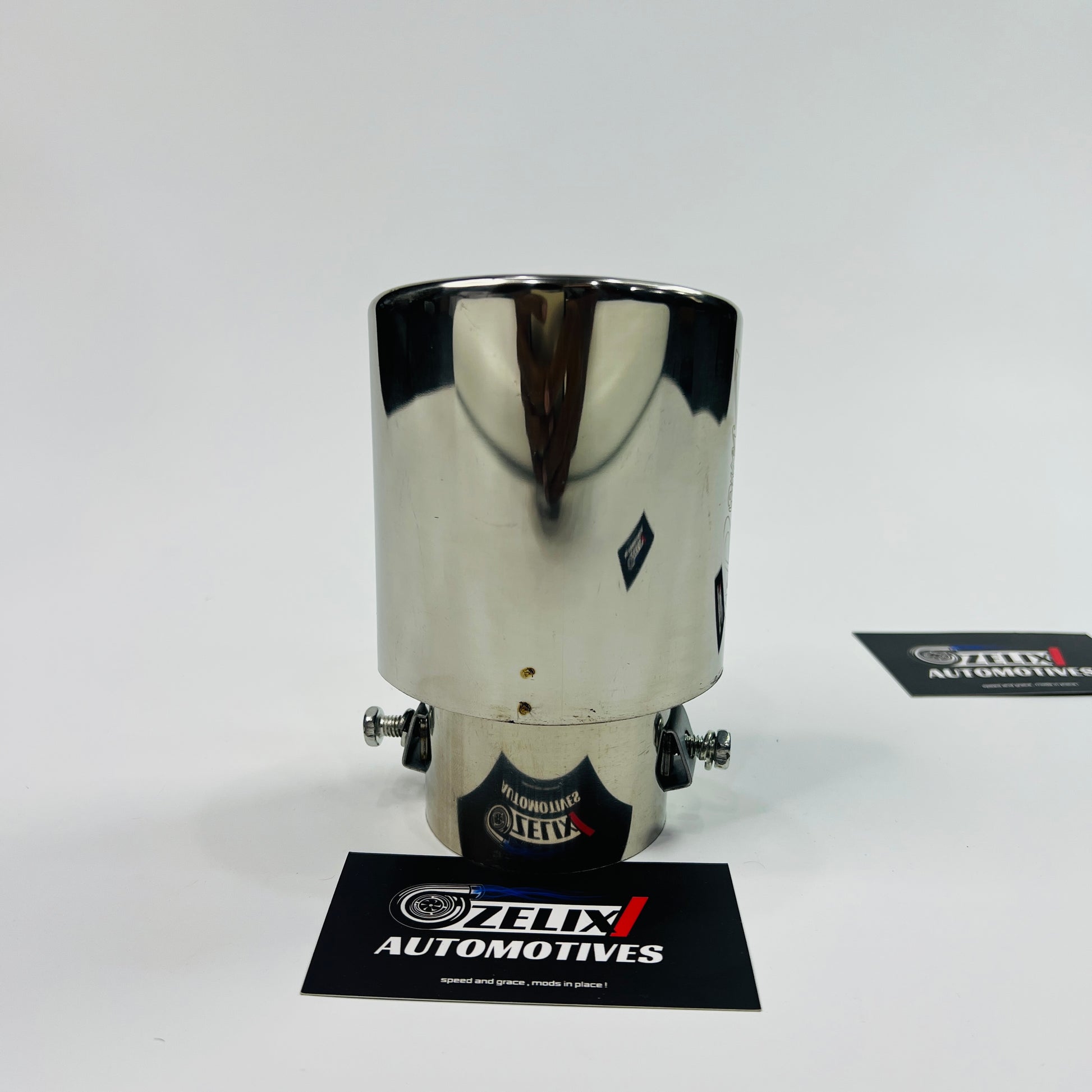 Universal HKS chrome single exhaust tip installed on car