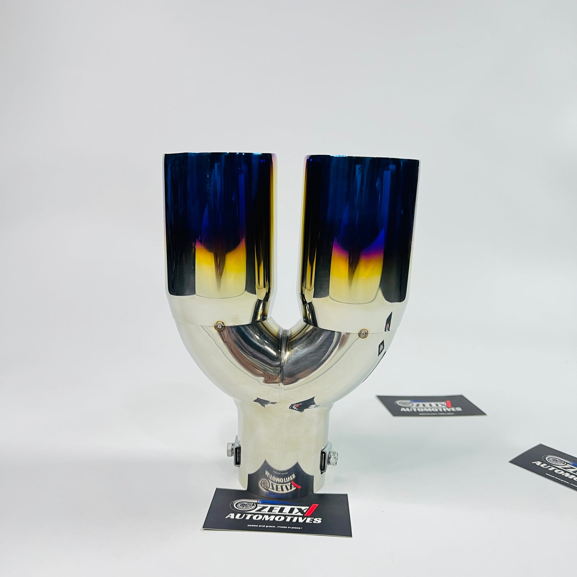 Universal HKS dual exhaust tip installed on car
