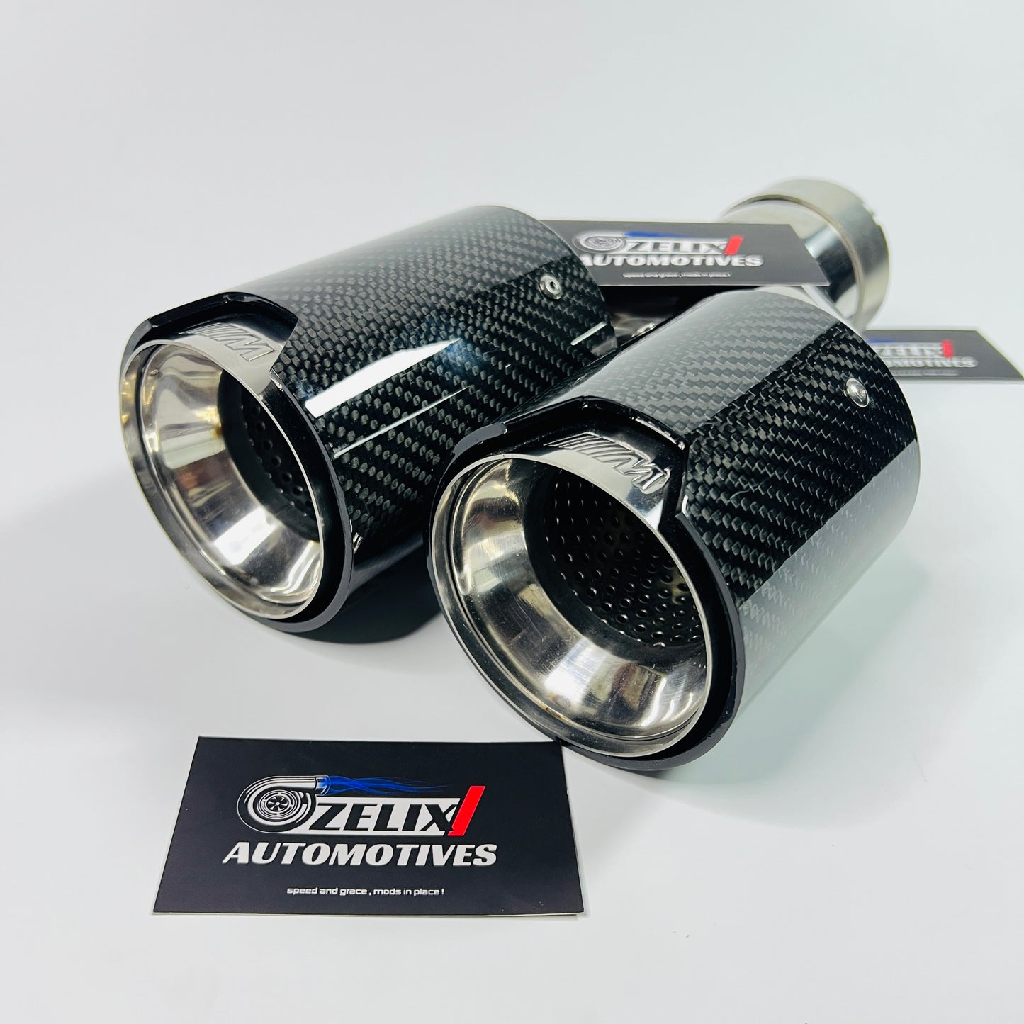 M Style dual tip exhaust installed on vehicle tailpipe