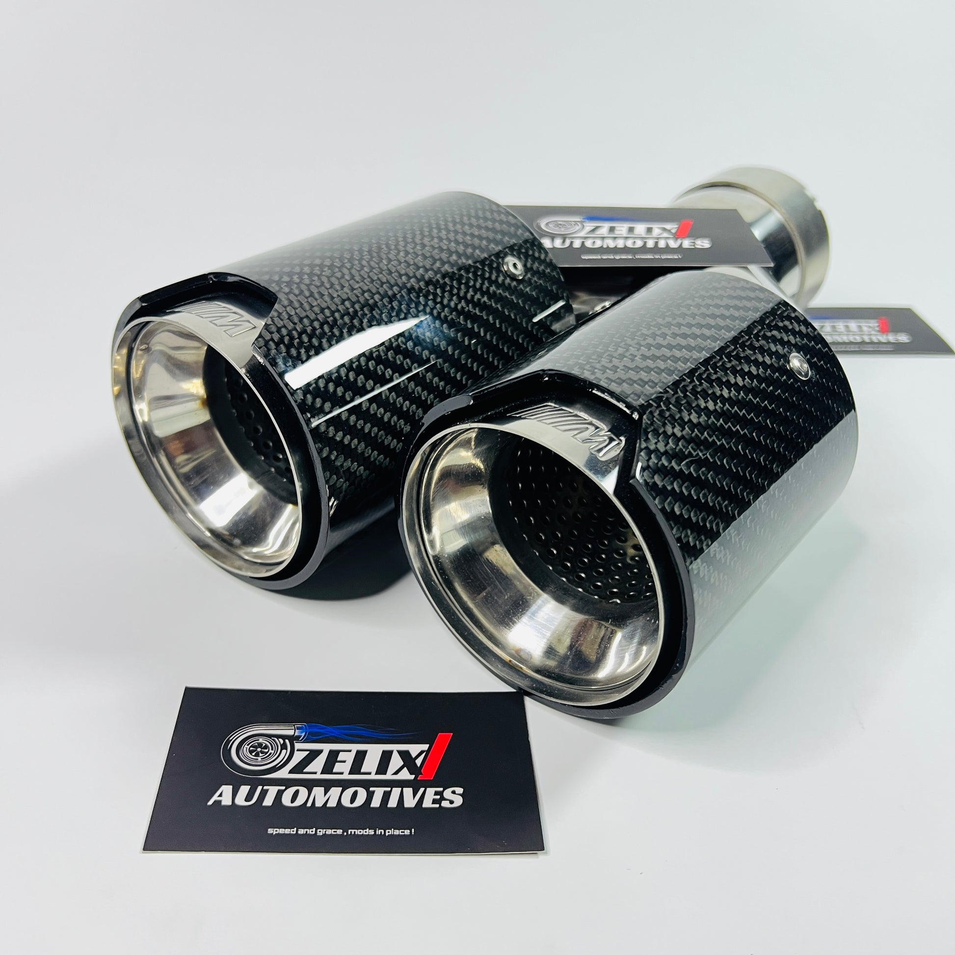 M Style dual tip exhaust installed on vehicle tailpipe